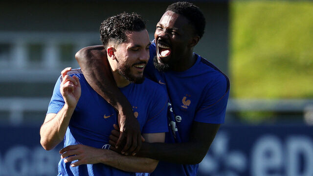 France's forward #24 Rayan Cherki (L) and France's forward #09 Marcus Thuram cheer during a training session at the national team training grounds in Clairefontaine-en-Yvelines, southwest of Paris, on June 1, 2026, as part of their preparation for the upcoming 2026 FIFA World Cup football tournament.