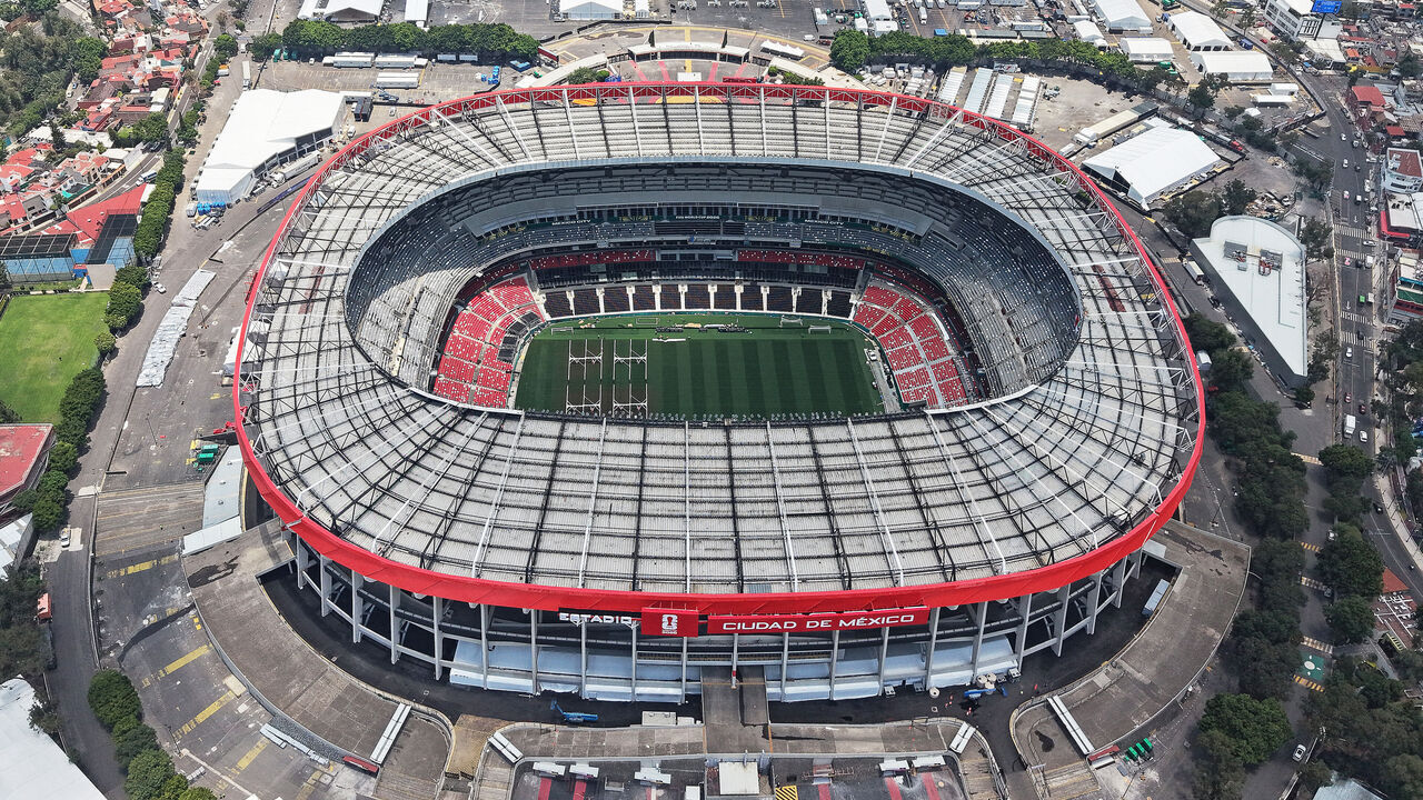 This aerial view shows the Mexico City Stadium, renamed from Azteca Stadium (or Banorte Stadium) for the FIFA World Cup, in Mexico City on May 28, 2026. FIFA temporarily branded the iconic Azteca Stadium as "Mexico City Stadium" for the 2026 World Cup, enforcing a strict "debranding" policy that requires all host stadiums to remove or cover non-official corporate sponsor names, suite branding, and external logos.