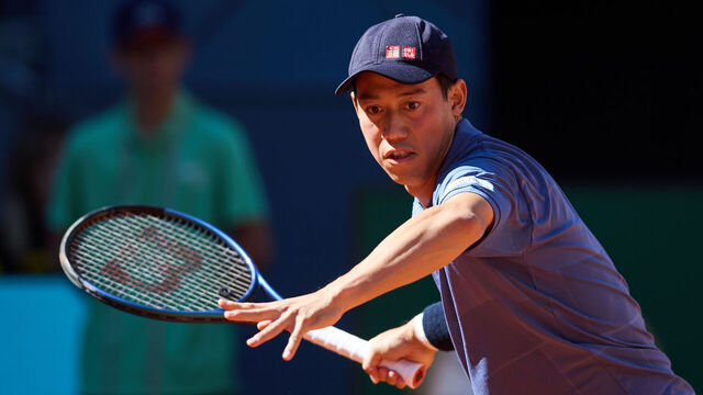 MADRID, SPAIN - APRIL 23: Kei Nishikori of Japan plays a forehand against Aleksandar Vukic of Australia in the Men's Singles First Round match during Day Three of the Mutua Madrid Open at La Caja Magica on April 23, 2025 in Madrid, Spain.