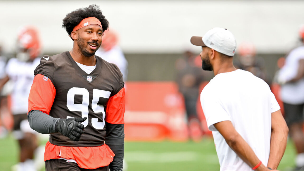 BEREA, OH - JULY 29: Defensive end Myles Garrett #95 of the Cleveland Browns talks with general manager Andrew Berry during the second day of Cleveland Browns Training Camp on July 29, 2021 in Berea, Ohio.