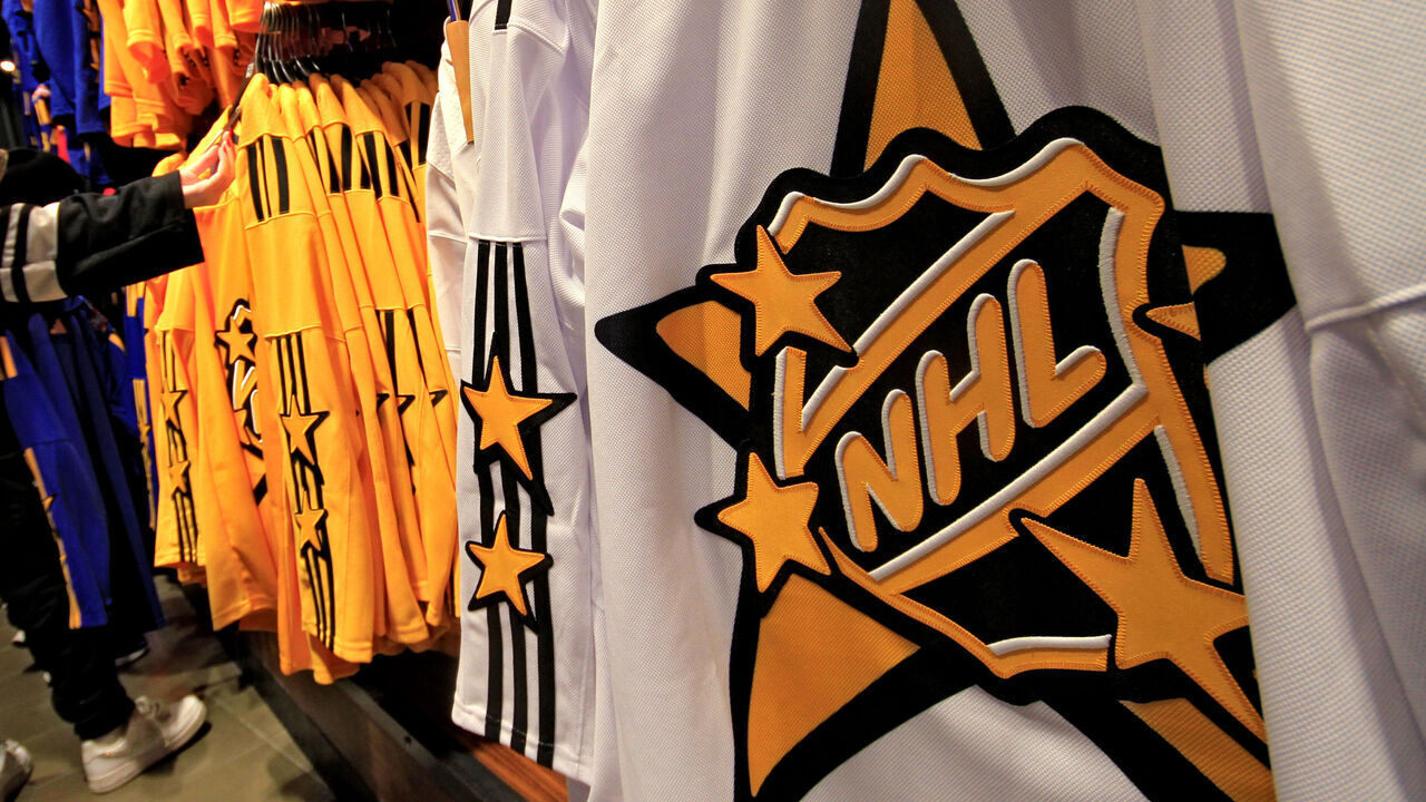 A hockey fan is looking at NHL All-Star hockey jerseys for sale at the Scotiabank Arena in Toronto, Canada, on February 3, 2024. Toronto is hosting the NHL All-Star game on February 3.