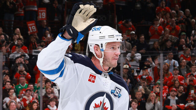 CHICAGO, ILLINOIS - JANUARY 19: Jonathan Toews #19 of the Winnipeg Jets waves to the crowd while beinghonored in the first period against the Chicago Blackhawks at the United Center on January 19, 2026 in Chicago, Illinois.