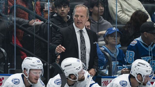 VANCOUVER, CANADA - MARCH 19: Jon Cooper, head coach of the Tampa Bay Lightning gestures while on the bench during NHL action against the Vancouver Canucks at Rogers Arena on March 19, 2026 in Vancouver, Canada.