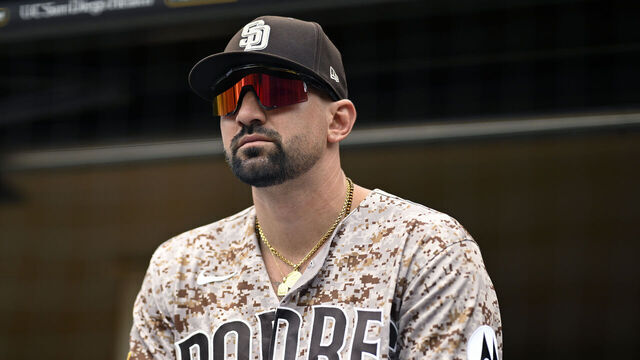 SAN DIEGO, CALIFORNIA - MAY 24: Nick Castellanos #21 of the San Diego Padres looks on from the dugout before the game against the Athletics at Petco Park on May 24, 2026 in San Diego, California.