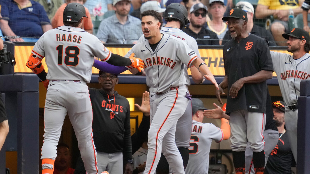 MILWAUKEE, WISCONSIN - JUNE 04: Willy Adames #2 congratulates Eric Haase #18 of the San Francisco Giants after hitting a grand slam in the seventh inning against the Milwaukee Brewers at American Family Field on June 04, 2026 in Milwaukee, Wisconsin.