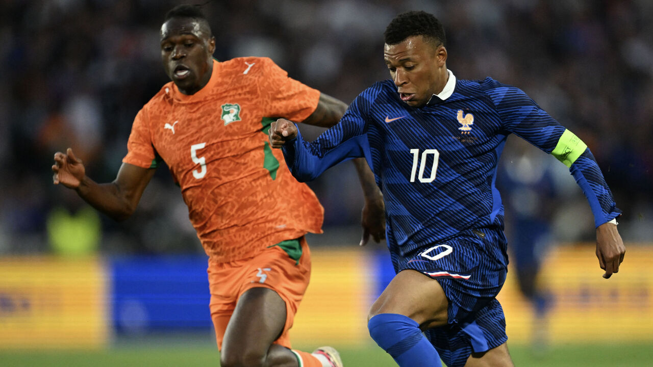 Ivory Coast's defender #05 Wilfried Stephane Singo (L) fights for the ball with France's forward #10 Kylian Mbappe (R) during the international friendly football match between France and Ivory Coast ahead of the 2026 FIFA World Cup football tournament at the Stade de la Beaujoire in Nantes, western France, on June 4, 2026.