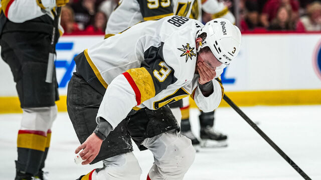 RALEIGH, NORTH CAROLINA - JUNE 04: Brayden McNabb #3 of the Vegas Golden Knights reacts after taking a shot to the face during the first period against the Carolina Hurricanes in Game Two of the 2026 Stanley Cup Final at Lenovo Center on June 04, 2026 in Raleigh, North Carolina.