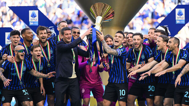 MILAN, ITALY - MAY 17: (L-R) Head Coach Cristian Chivu of FC Internazionale and Lautaro Martinez of FC Internazionale lift the Serie A Trophy alongside team-mates after winning the Serie A match between FC Internazionale and Hellas Verona FC at Giuseppe Meazza Stadium on May 17, 2026 in Milan, Italy.