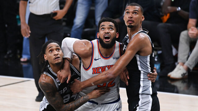 SAN ANTONIO, TX - JUNE 3: Devin Vassell #24 of the San Antonio Spurs, Karl-Anthony Towns #32 of the New York Knicks, and Victor Wembanyama #1 of the San Antonio Spurs look on during the game during Game One of the 2026 NBA Finals on June 3, 2026 at Frost Bank Center in San Antonio, Texas. Mandatory Copyright Notice: Copyright 2026 NBAE