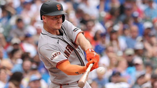 CHICAGO, ILLINOIS - JUNE 05: Matt Chapman #26 of the San Francisco Giants hits a RBI sacrifice fly against the Chicago Cubs during the fifth inning at Wrigley Field on June 05, 2026 in Chicago, Illinois.