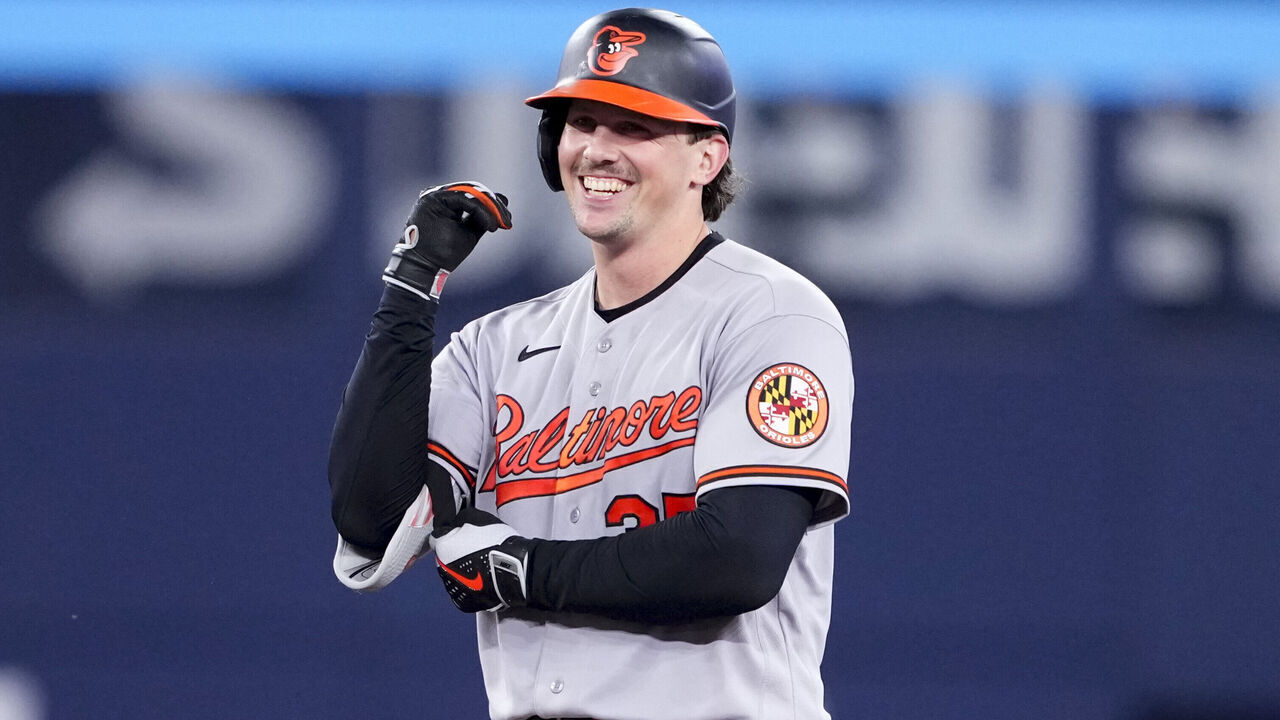 TORONTO, CANADA - JUNE 5: Adley Rutschman #35 of the Baltimore Orioles celebrates his two-RBI double against the Toronto Blue Jays during the ninth inning of an MLB game at the Rogers Centre on June 5, 2026 in Toronto, Ontario, Canada.