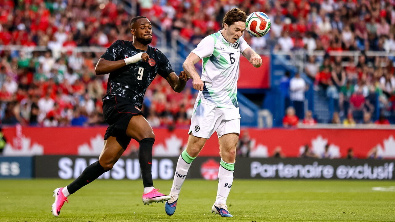 Québec , Canada - 5 June 2026; Conor Coventry of Republic of Ireland in action against Cyle Larin of Canada during the international friendly match between Canada and Republic of Ireland at Stade Saputo in Montreal, Canada.