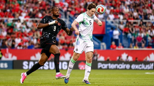 Québec , Canada - 5 June 2026; Conor Coventry of Republic of Ireland in action against Cyle Larin of Canada during the international friendly match between Canada and Republic of Ireland at Stade Saputo in Montreal, Canada.