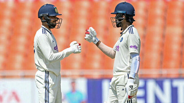 India's captain Shubman Gill (L) and KL Rahul bump their fists during the first day of the only Test cricket match between India and Afghanistan at the Maharaja Yadavindra Singh International Cricket Stadium on the outskirts of Chandigarh on June 6, 2026.