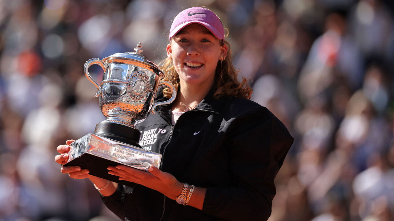 Russia's Mirra Andreeva holds the trophy after winning the French Open tennis tournament women's singles final match against Poland's Maja Chwalinska on day 14 of the French Open tennis tournament on Court Philippe-Chatrier at the Roland-Garros Complex in Paris on June 6, 2026.