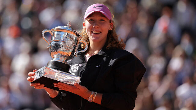 Russia's Mirra Andreeva holds the trophy after winning the French Open tennis tournament women's singles final match against Poland's Maja Chwalinska on day 14 of the French Open tennis tournament on Court Philippe-Chatrier at the Roland-Garros Complex in Paris on June 6, 2026.