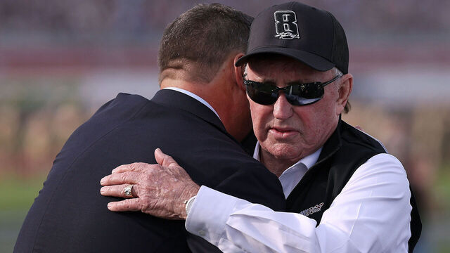CONCORD, NORTH CAROLINA - MAY 24: NASCAR Hall of Famer and RCR team owner, Richard Childress, (R) and NASCAR Chief Executive Officer Steve O’Donnell embrace on the grid during the remembrance ceremony for Kyle Busch, who passed away suddenly at the age of 41, prior to the NASCAR Cup Series Coca-Cola 600 at Charlotte Motor Speedway on May 24, 2026 in Concord, North Carolina.