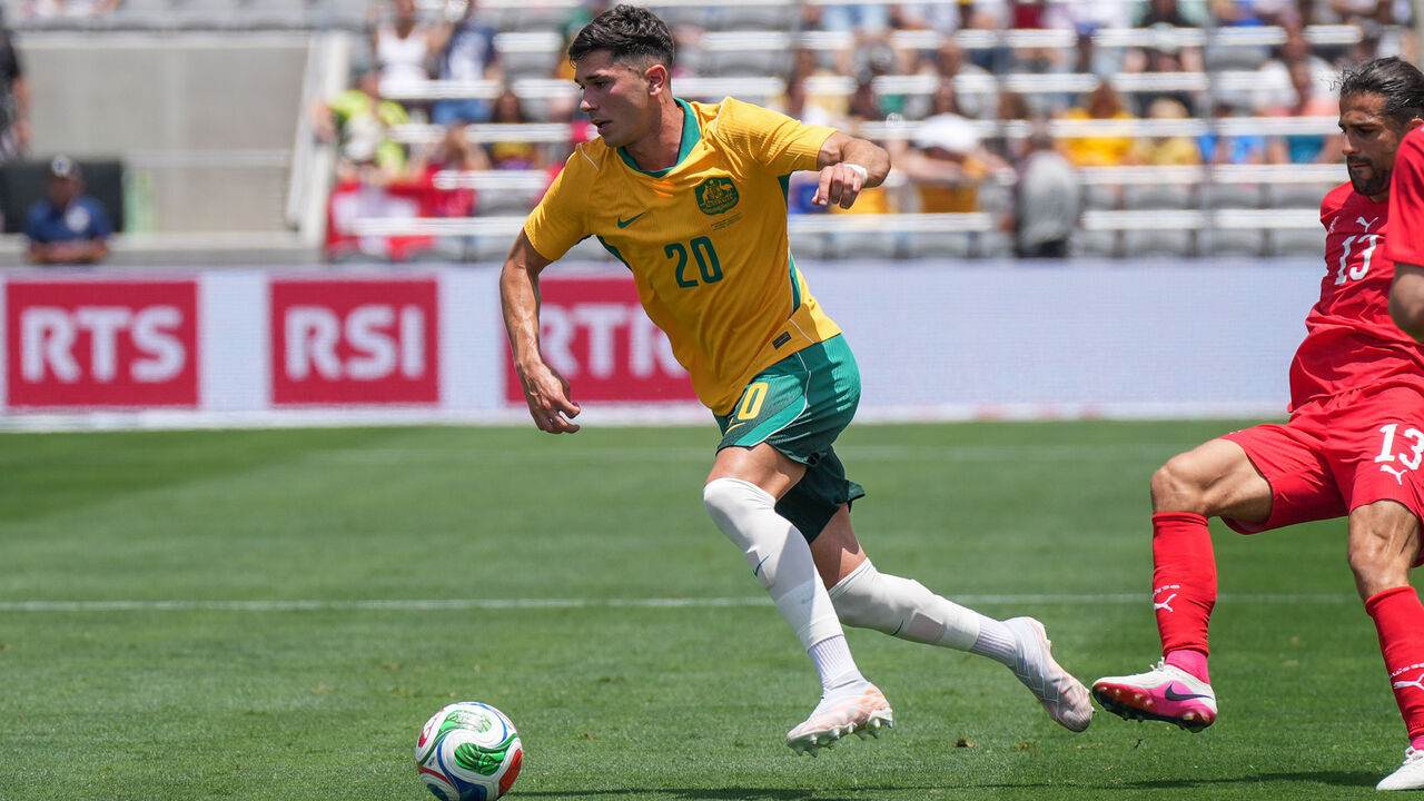 SAN DIEGO, CA - JUNE 6: Cristian Volpato #20 of Australia dribbles the ball during a game between Australia and Switzerland at Snapdragon Stadium on June 6, 2026 in San Diego, California.