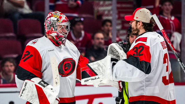 MONTREAL, CANADA - MAY 27: Frederik Andersen #31 of the Carolina Hurricanes celebrates with Brandon Bussi #32 after a 4-0 victory against the Montréal Canadiens in Game Four of the Eastern Conference Final of the 2026 Stanley Cup Playoffs at Centre Bell on May 27, 2026 in Montreal, Quebec, Canada.