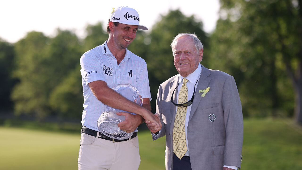 DUBLIN, OHIO - JUNE 07: J.T. Poston of the United States shakes hands with Jack Nicklaus as he presents him the trophyduring the final round of the the Memorial Tournament presented by Workday 2026 at Muirfield Village Golf Club on June 07, 2026 in Dublin, Ohio.