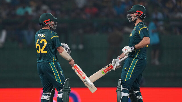 KANDY, SRI LANKA - FEBRUARY 16: Travis Head of Australia celebrates reaching his half century with teammate Mitchell Marsh during the ICC Men's T20 World Cup India & Sri Lanka 2026 match between Australia and Sri Lanka at Pallekele Cricket Stadium on February 16, 2026 in Kandy, Sri Lanka.