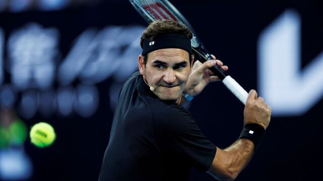 Former tennis player Roger Federer of Switzerland hits a return during the opening ceremony exhibition match at the 2026 Australian Open at Melbourne Park in Melbourne, Australia, Jan. 17, 2026.