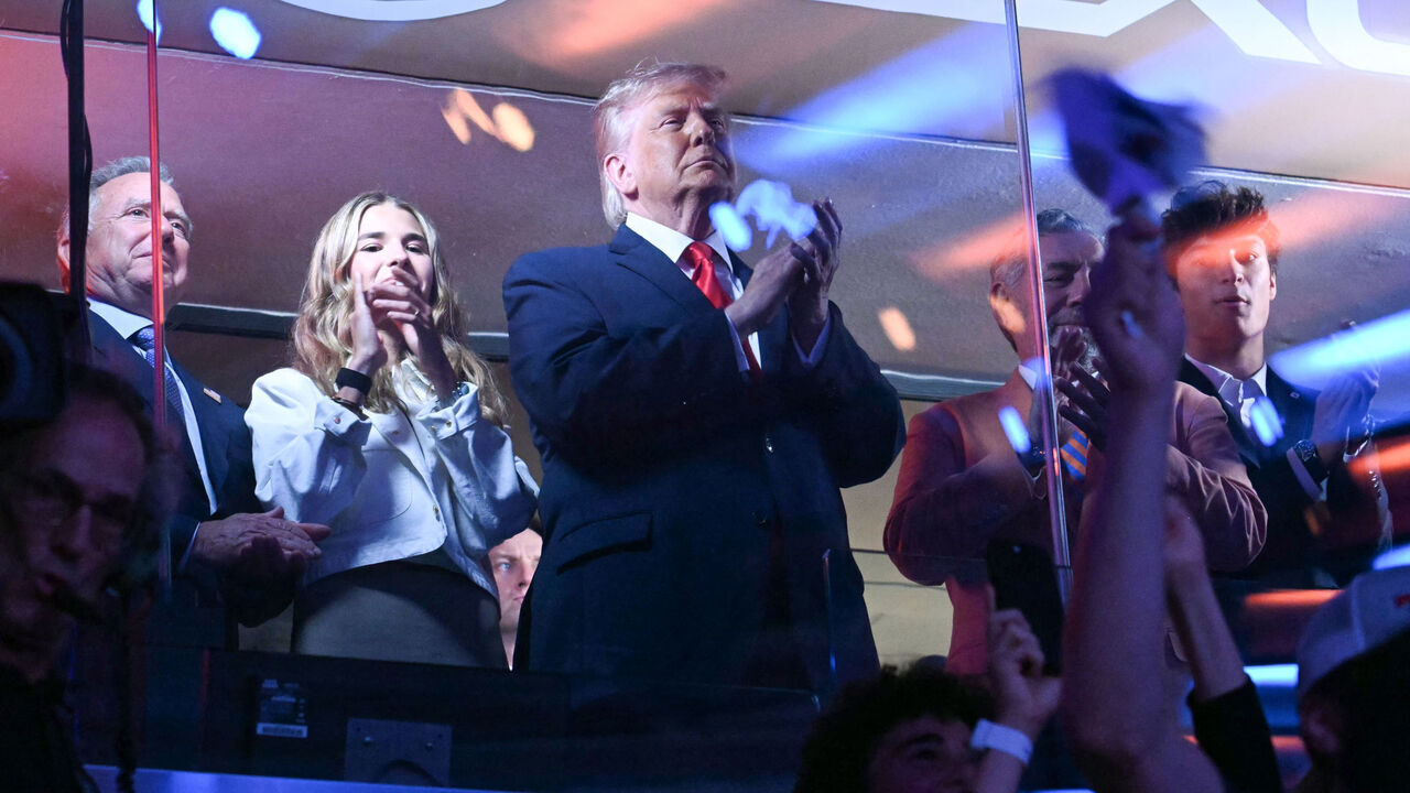 US President Donald Trump with his grand daughter Kai Trump (2L) and Knicks owner James Dolan attend Game Three of the NBA Finals between the San Antonio Spurs and the New York Knicks at Madison Square Garden in New York on June 8, 2026.