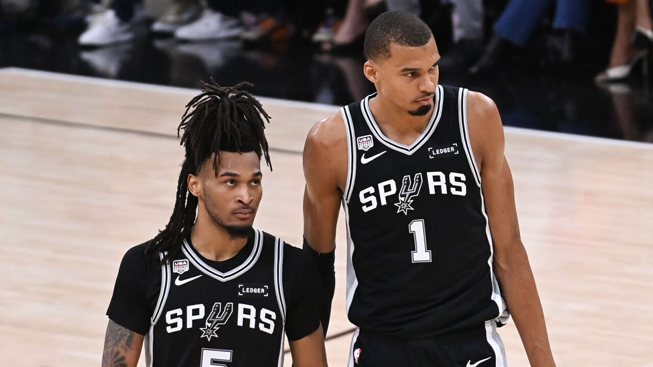 SAN ANTONIO, TX - JUNE 3: Stephon Castle #5 and Victor Wembanyama #1 of the San Antonio Spurs look on during the game against the New York Knicks during Game One of the 2026 NBA Finals on June 3, 2026 at Frost Bank Center in San Antonio, Texas. Mandatory Copyright Notice: Copyright 2026 NBAE