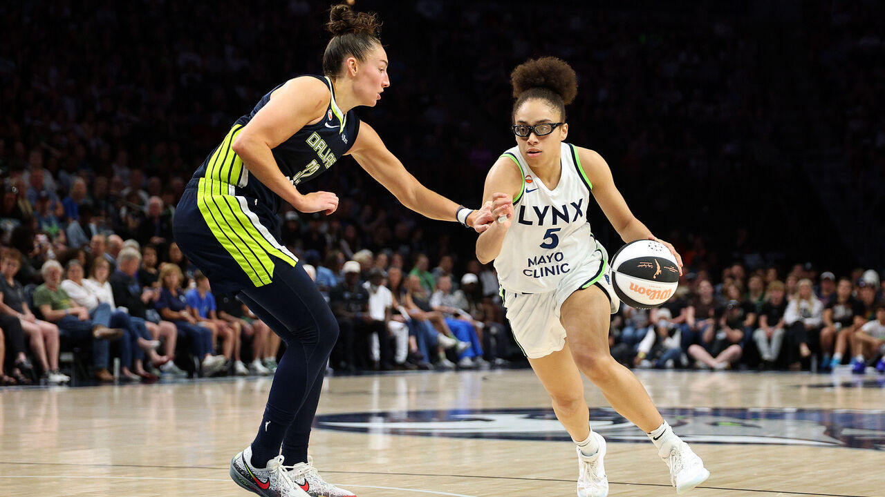 MINNEAPOLIS, MINNESOTA - JUNE 09: Olivia Miles #5 of the Minnesota Lynx drives to the basket against Jessica Shepard #32 of the Dallas Wings in the fourth quarter at Target Center on June 09, 2026 in Minneapolis, Minnesota. The Lynx defeated the Wings 100-76.
