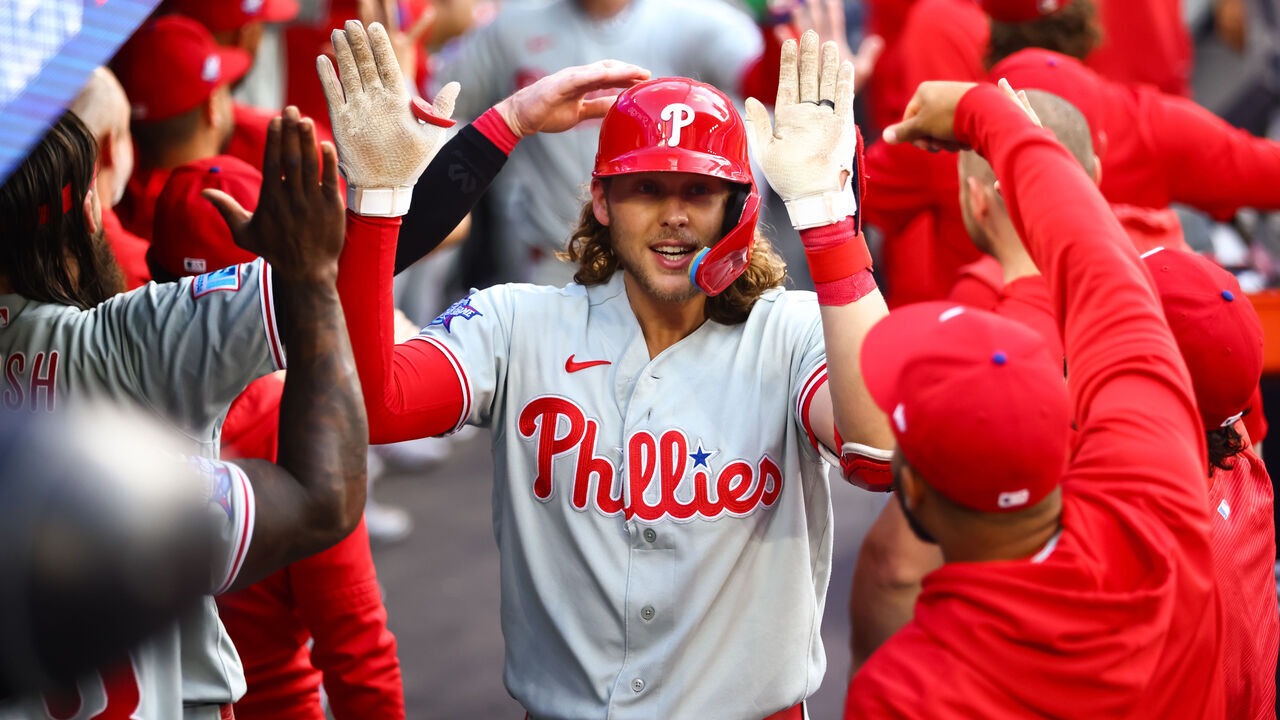 TORONTO, CANADA - JUNE 10: Alec Bohm #28 of the Philadelphia Phillies celebrates in the dugout after hitting a three-run home run to score in Kyle Schwarber #12 and Bryce Harper #3 in the third inning of their MLB game against the Toronto Blue Jays at Rogers Centre on June 10, 2026 in Toronto, Ontario, Canada.