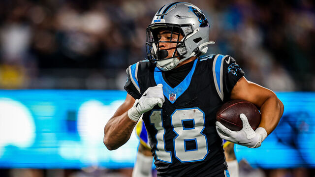 CHARLOTTE, NORTH CAROLINA - JANUARY 10: Jalen Coker #18 of the Carolina Panthers runs the ball during the second half of the NFC Wild Card Playoff game against the Los Angeles Rams at Bank of America Stadium on January 10, 2026 in Charlotte, North Carolina.
