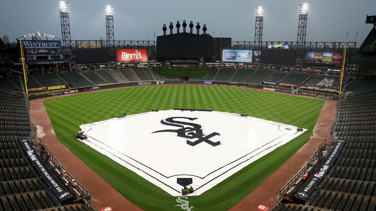 CHICAGO, ILLINOIS - JUNE 10: A general view of the interior of Rate Field with the tarp covering the infield while it's raining prior to the game between the Atlanta Braves and the Chicago White Sox at Rate Field on June 10, 2026 in Chicago, Illinois.