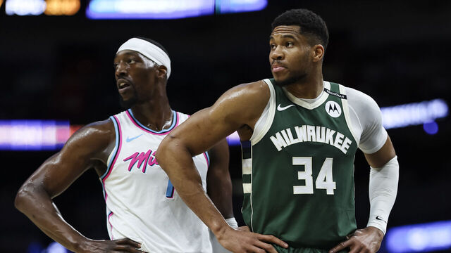 MIAMI, FLORIDA - APRIL 05: Bam Adebayo #13 of the Miami Heat and Giannis Antetokounmpo #34 of the Milwaukee Bucks look on at Kaseya Center on April 05, 2025 in Miami, Florida.