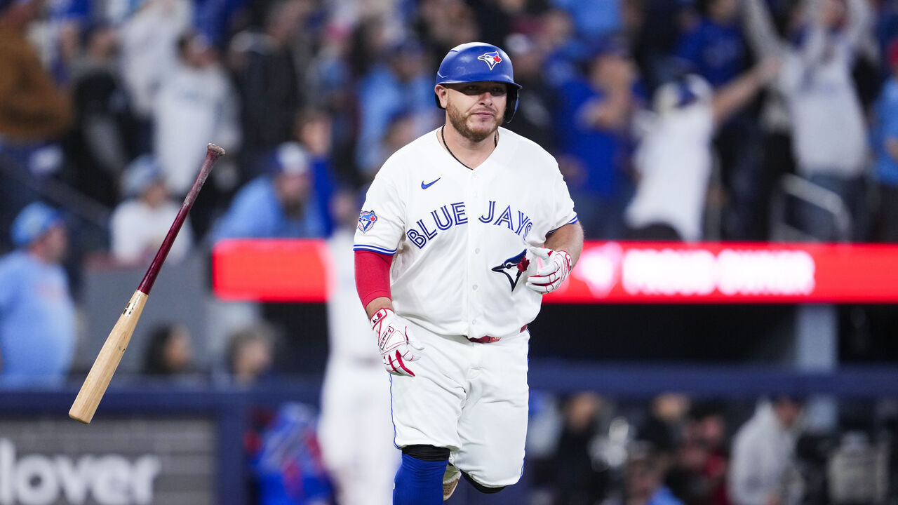 TORONTO, CANADA - MARCH 28: Alejandro Kirk #30 of the Toronto Blue Jays hits a solo home run against the Athletics during the ninth inning in their MLB game at Rogers Centre on March 28, 2026 in Toronto, Ontario, Canada.
