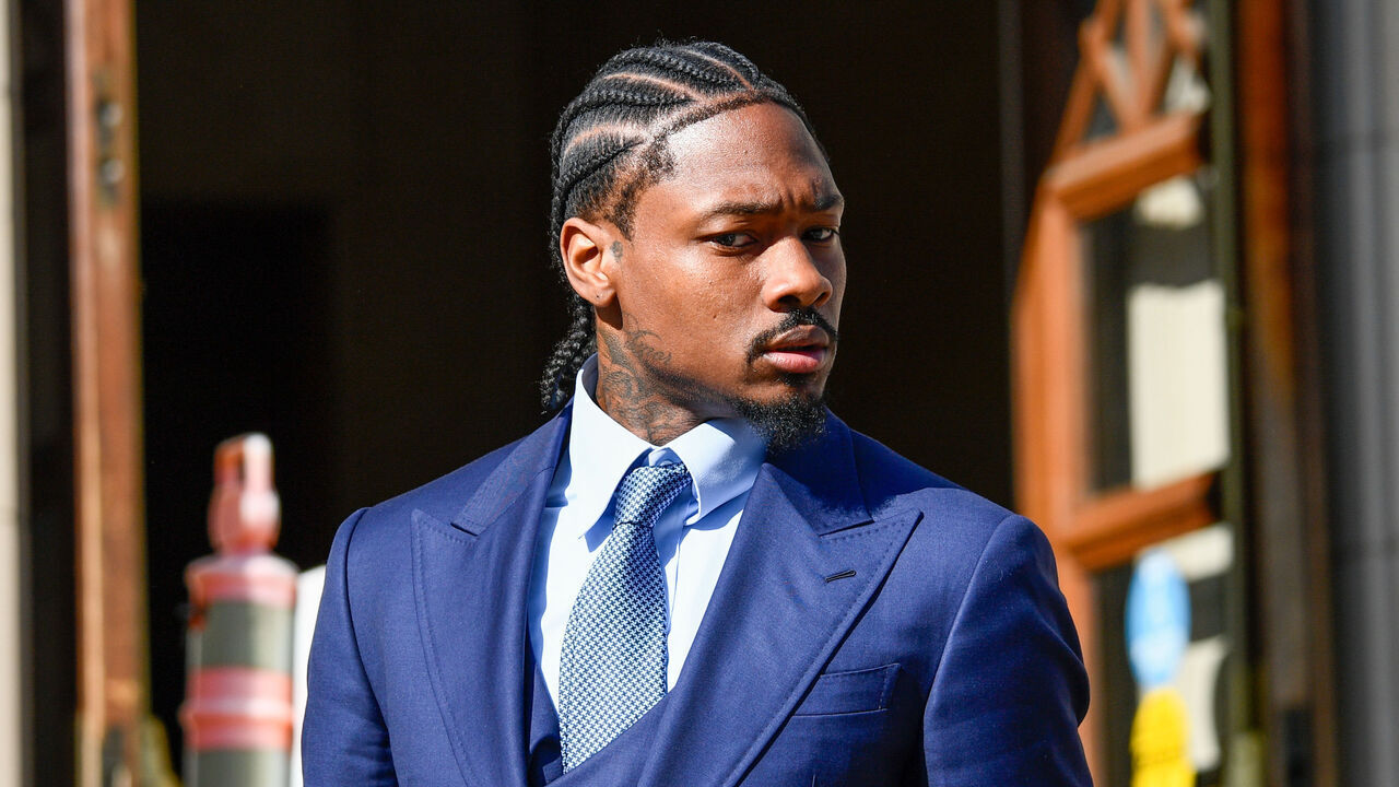 DEDHAM, MA - MAY 04: Professional football wide receiver Stefon Diggs walks out of Dedham District Court on May 4, 2026, following the first day of his assault trial. Diggs has pleaded not guilty to charges of felony strangulation and misdemeanor assault and battery.