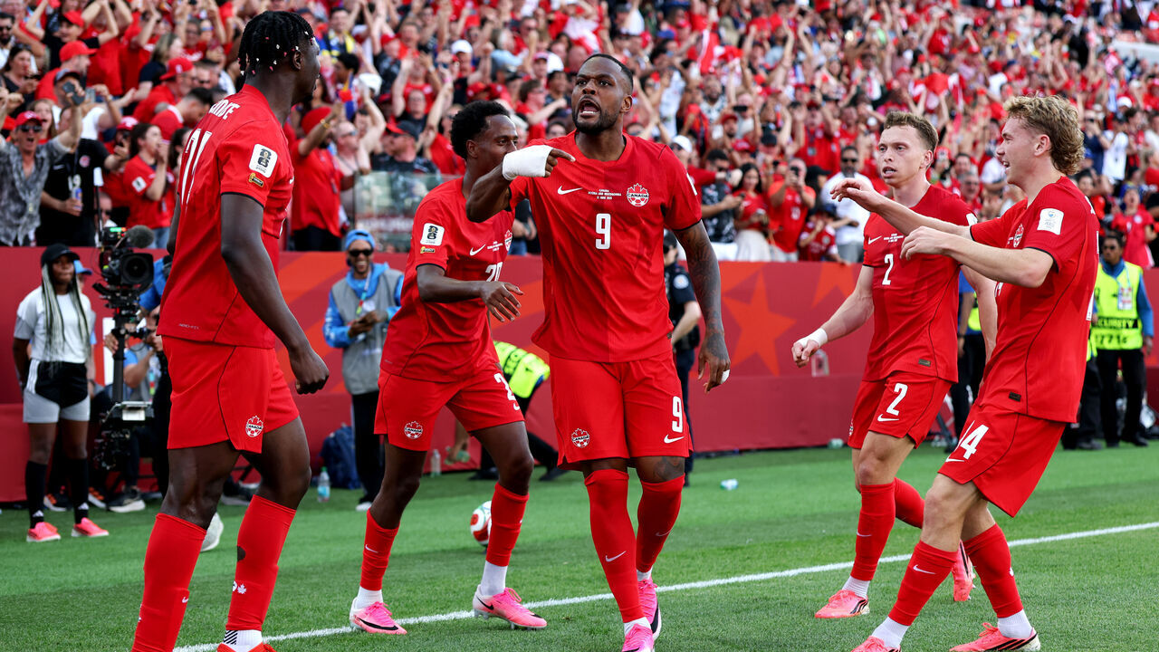 TORONTO, ONTARIO - JUNE 12: Cyle Larin #9 of Canada celebrates with teammates after scoring the team's first goal during the FIFA World Cup 2026 Group B match between Canada and Bosnia and Herzegovina at Toronto Stadium on June 12, 2026 in Toronto, Ontario.