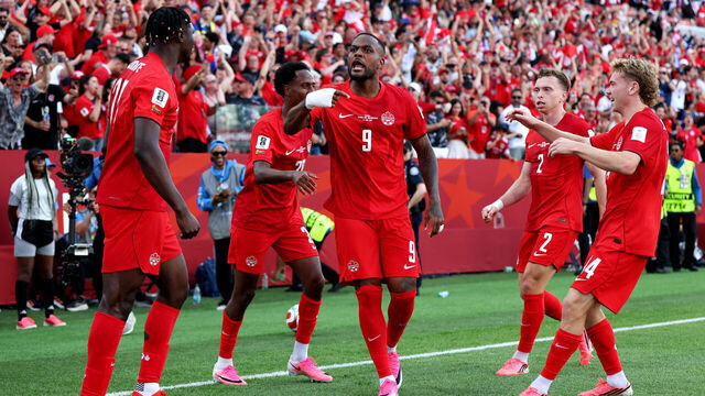 TORONTO, ONTARIO - JUNE 12: Cyle Larin #9 of Canada celebrates with teammates after scoring the team's first goal during the FIFA World Cup 2026 Group B match between Canada and Bosnia and Herzegovina at Toronto Stadium on June 12, 2026 in Toronto, Ontario.