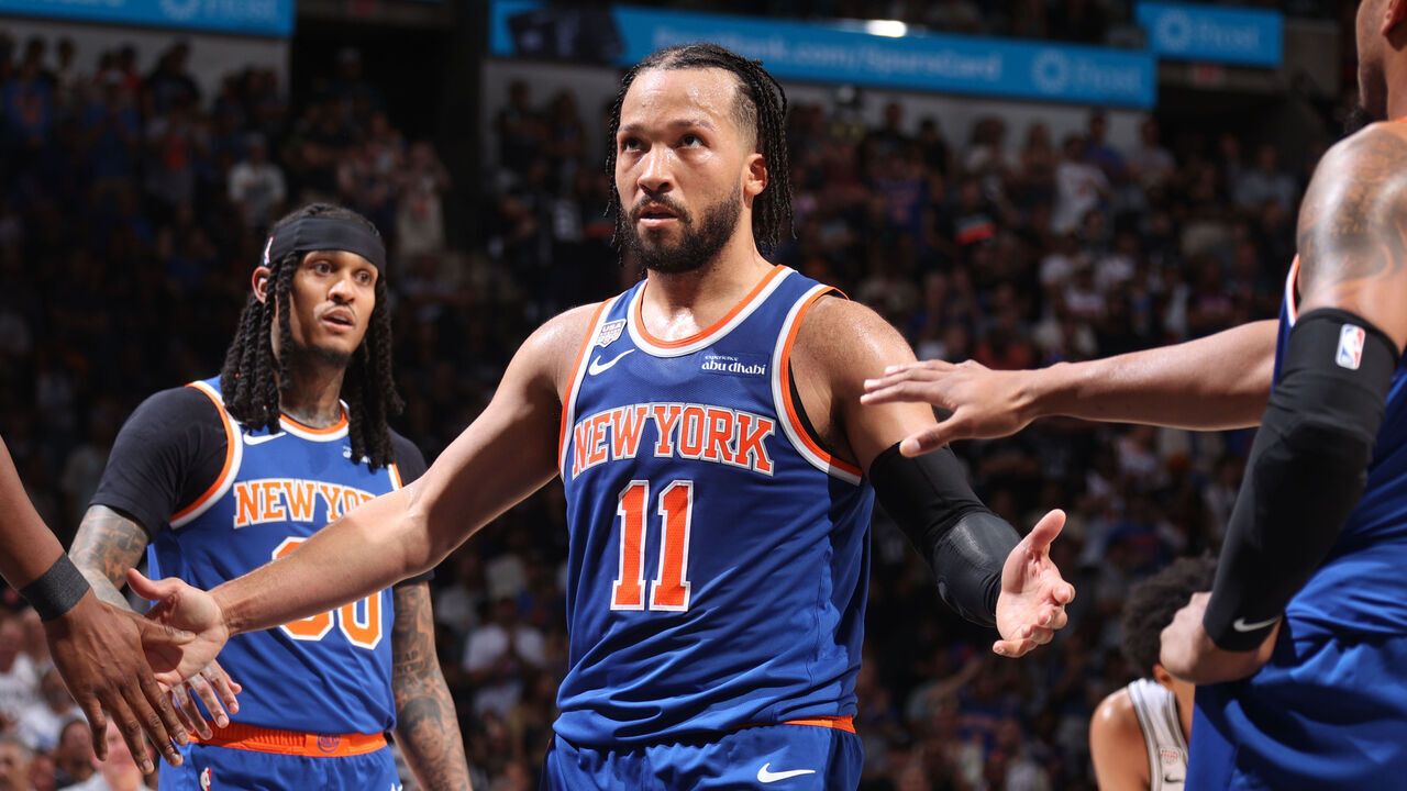 SAN ANTONIO, TX - JUNE 13: Jalen Brunson #11 of the New York Knicks high fives teammates during the game against the San Antonio Spurs during Game Five of the 2026 NBA Finals on June 13, 2026 at Frost Bank Center in San Antonio, Texas. Mandatory Copyright Notice: Copyright 2026 NBAE
