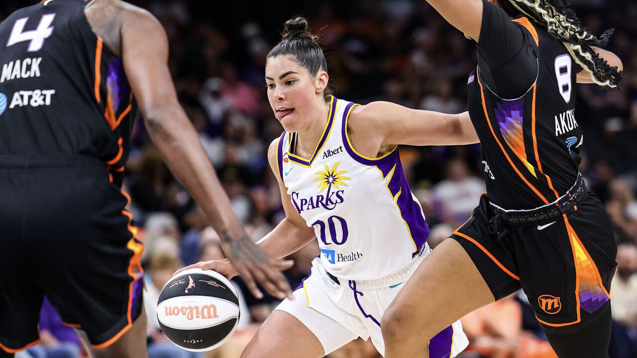 PHOENIX, ARIZONA - JUNE 13: Kelsey Plum #10 of the Los Angeles Sparks dribbles the ball during the third quarter against the Phoenix Mercury at Mortgage Matchup Center on June 13, 2026 in Phoenix, Arizona.