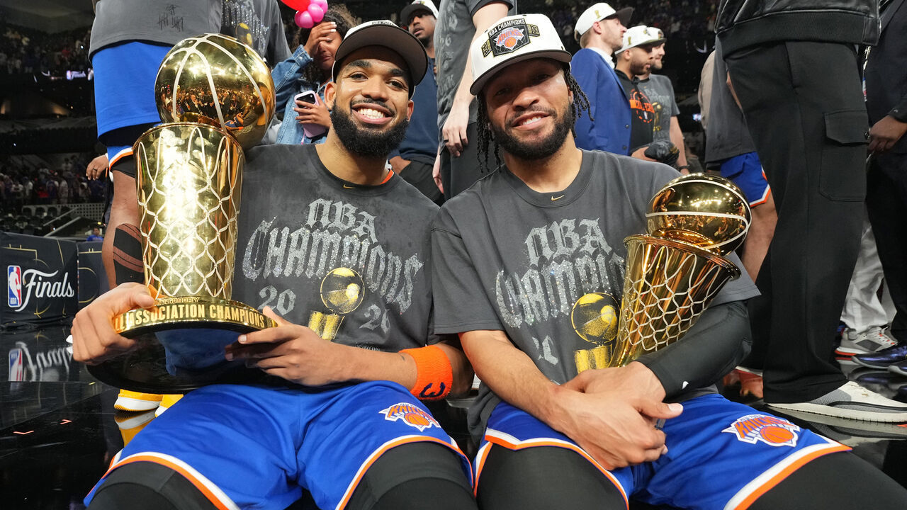SAN ANTONIO, TX - JUNE 13: Karl-Anthony Towns #32 and Jalen Brunson #11 of the New York Knicks pose for a photo with the Larry O'Brien Championship Trophy and the Bill Russell NBA Finals Most Valuable Player Award after the game against the San Antonio Spurs during Game Five of the 2026 NBA Finals on June 13, 2026 at Frost Bank Center in San Antonio, Texas. Mandatory Copyright Notice: Copyright 2026 NBAE