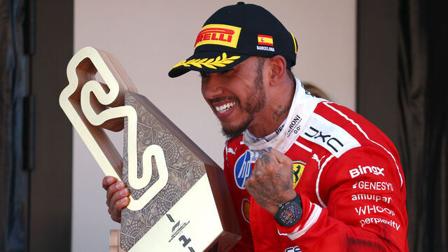 BARCELONA, SPAIN - JUNE 14: Race winner Lewis Hamilton of Great Britain and Scuderia Ferrari celebrates on the podium with his trophy during the F1 Grand Prix of Barcelona-Catalunya at Circuit de Barcelona-Catalunya on June 14, 2026 in Barcelona, Spain.