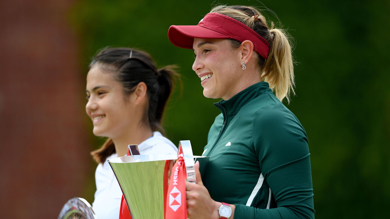 LONDON, ENGLAND - JUNE 14: Runner-Up Emma Raducanu of Great Britain and Winner Donna Vekic of Croatia pose for a photo with their trophy after the Women's Singles final match on Day Seven of the HSBC Championships at The Queen's Club on June 14, 2026 in London, England.