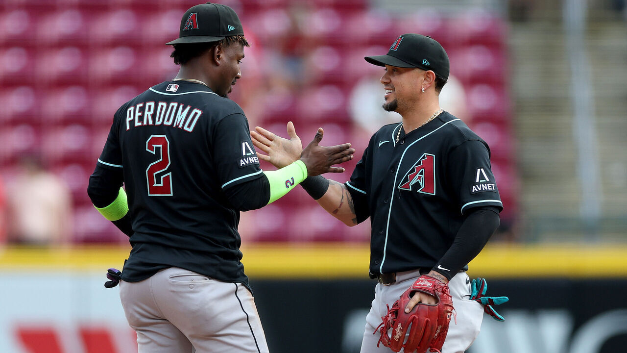 CINCINNATI, OHIO - JUNE 14: Geraldo Perdomo #2 and Ildemaro Vargas #6 of the Arizona Diamondbacks celebrates after the 5-3 win over the Cincinnati Reds at Great American Ball Park on June 14, 2026 in Cincinnati, Ohio.