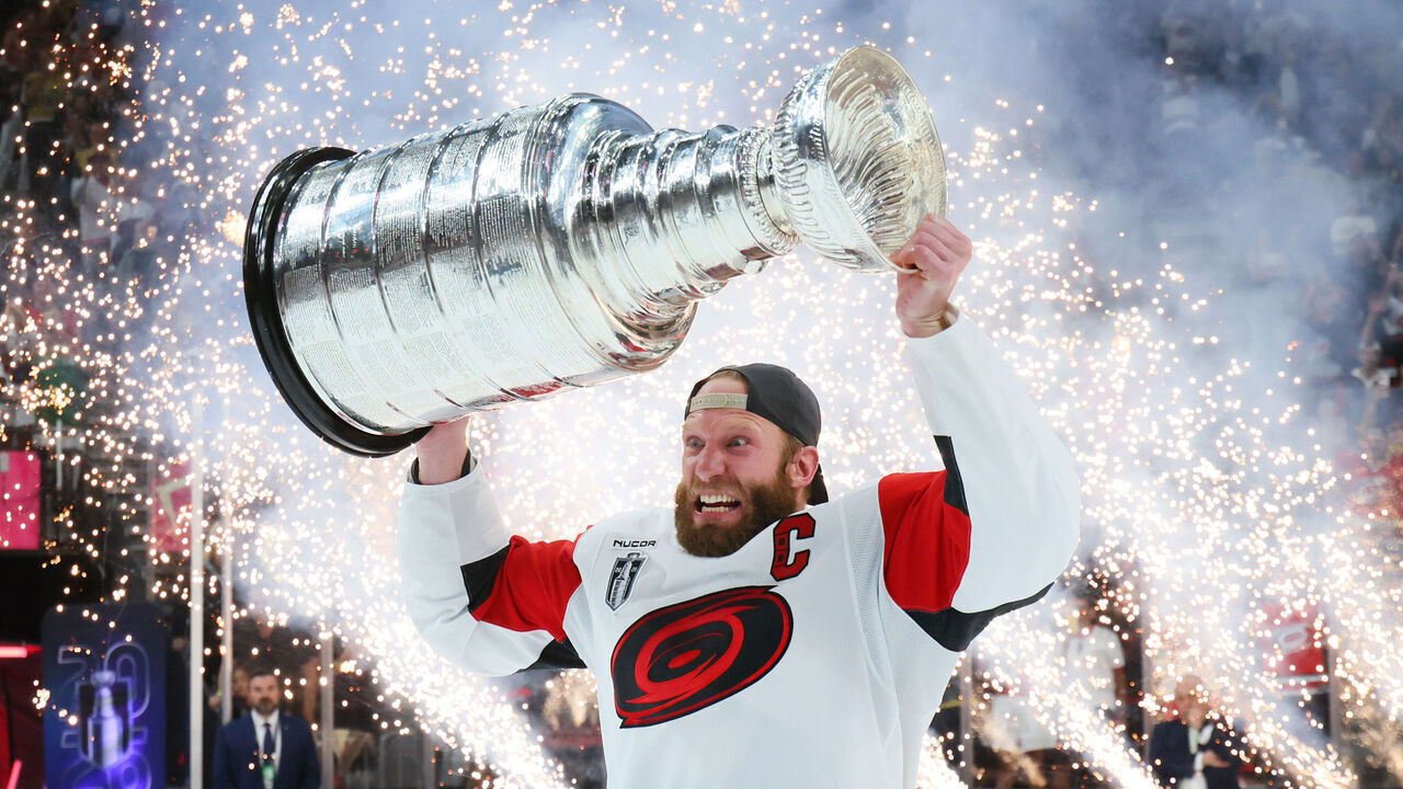 LAS VEGAS, NEVADA - JUNE 14: Jordan Staal #11 of the Carolina Hurricanes holds the Stanley Cup trophy after winning in Game Six of the 2026 Stanley Cup Final against the Vegas Golden Knights 3-0 in Game Six of the 2026 Stanley Cup Final at T-Mobile Arena on June 14, 2026 in Las Vegas, Nevada.