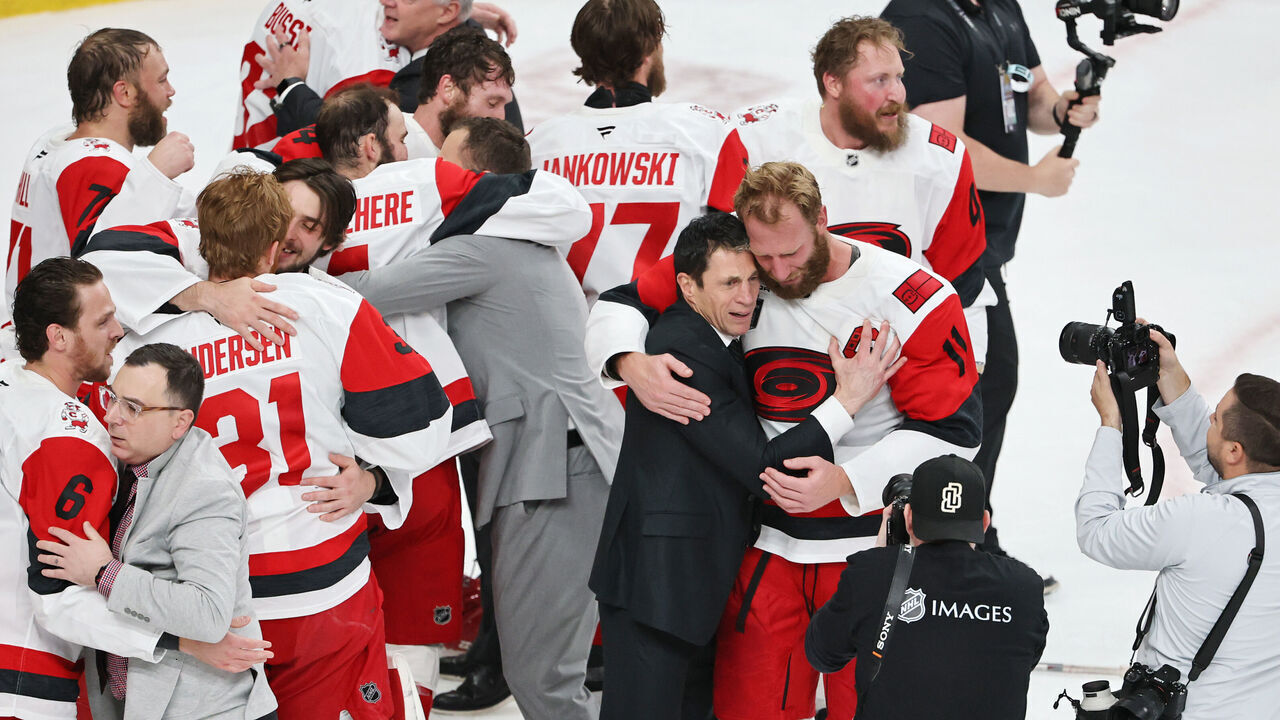 LAS VEGAS, NEVADA - JUNE 14: Jordan Staal #11 of the Carolina Hurricanes and head coach Rod Brind'Amour of the Carolina Hurricanes hug after Game Six of the 2026 Stanley Cup Final at T-Mobile Arena on June 14, 2026 in Las Vegas, Nevada.