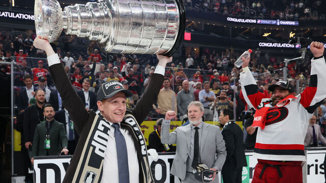 LAS VEGAS, NEVADA - JUNE 14: General manager Eric Tulsky lifts the Stanley Cup after Game Six of the 2026 Stanley Cup Final against the Vegas Golden Knights at T-Mobile Arena on June 14, 2026 in Las Vegas, Nevada. The Carolina Hurricanes won 3-0.