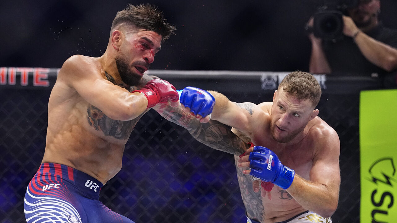 WASHINGTON, DC - JUNE 14: Justin Gaethje strikes Ilia Topuria of Spain in the UFC lightweight championship fight during the UFC Freedom 250 event on the South Lawn at the White House on June 14, 2026 in Washington, DC.
