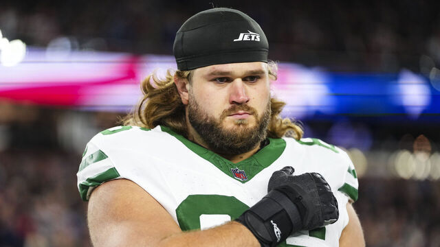 FOXBOROUGH, MA - NOVEMBER 13: Joe Tippmann #66 of the New York Jets looks on from the sideline during the national anthem prior to an NFL football game against the New England Patriots at Gillette Stadium on November 13, 2025 in Foxborough, Massachusetts.