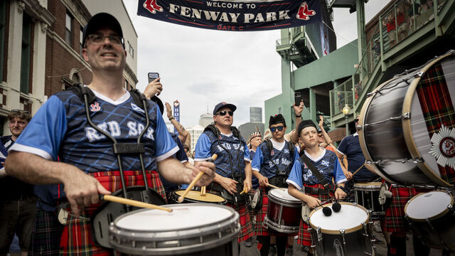 BOSTON, MASSACHUSETTS - JUNE 14: Members of Scotland's "Tartan Army" march down Lansdowne Street to Fenway Park before a game between the Texas Rangers and the Boston Red Sox on June 14, 2026 in Boston, Massachusetts.