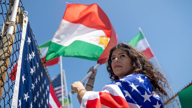 Encino, CA, - June 14, 2026: Mehrzad Mozhdekanloo protests FIFA restrictions while displaying the pre-1979 Iranian flag on Sunday, June 14, 2026 in Encino, CA. FIFA prohibits fans from displaying the pre-1979 Iranian "Lion and Sun" flag at World Cup venues.(Eric Thayer / Los Angeles Times via Getty Images)